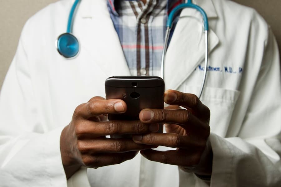 Healthcare professional using a tablet in a medical office